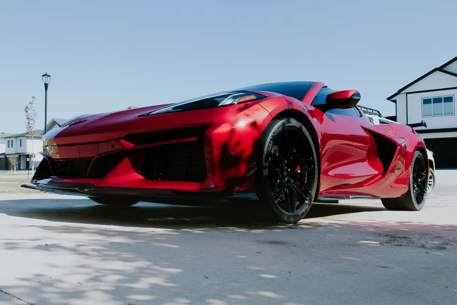 Red Corvette Z06 with a deep gloss finish after a detail